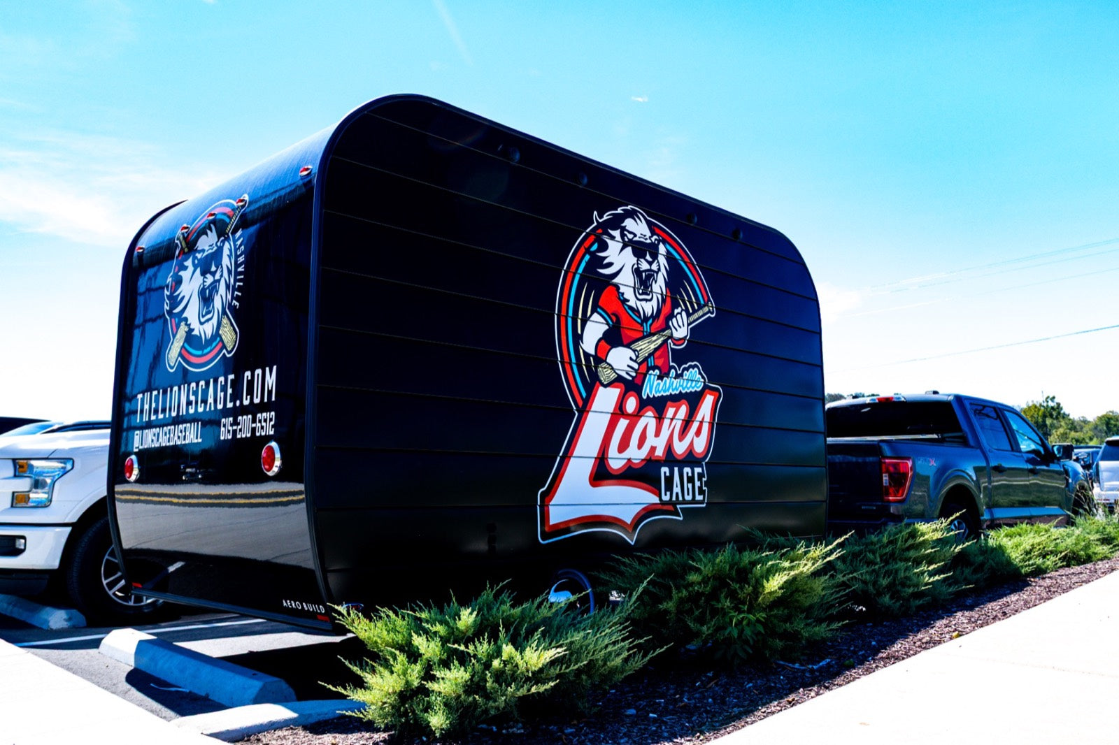 Lions Cage mobile trailer at outdoor event